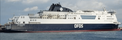 A vehicle ferry setting sail.