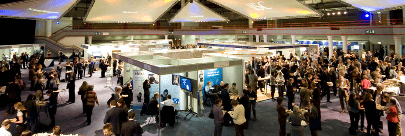 Over head shot of many people attending an exhibition.